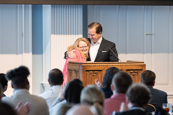 Susie Cassel receiving the award for Staff Member of the Year from DBU President Dr. Adam C. Wright in the Hillcrest Great Hall on the DBU Campus